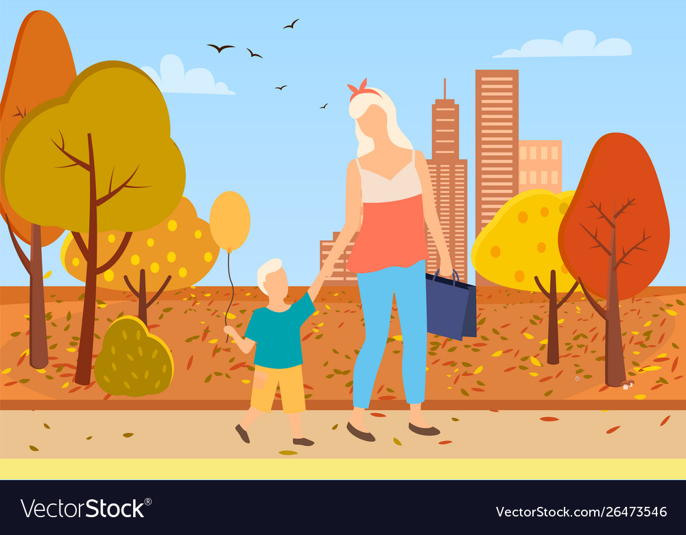 Mother and son toddler walk city park autumn trees