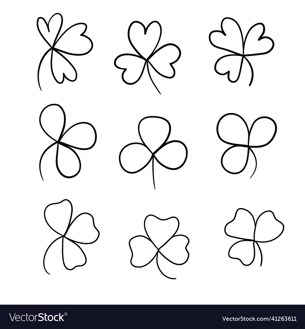 Hand drawn brush shamrocks on white background