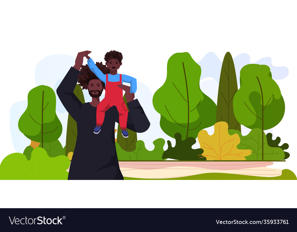 African american father playing with little son