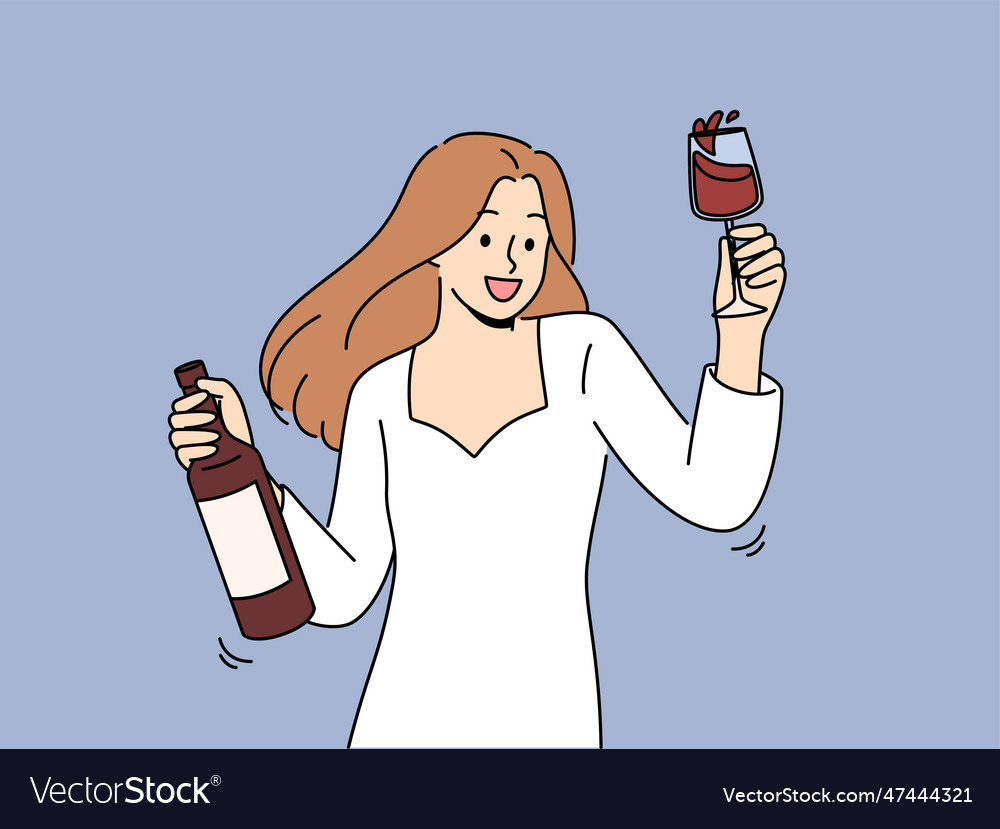 Woman dances at party holding bottle of wine