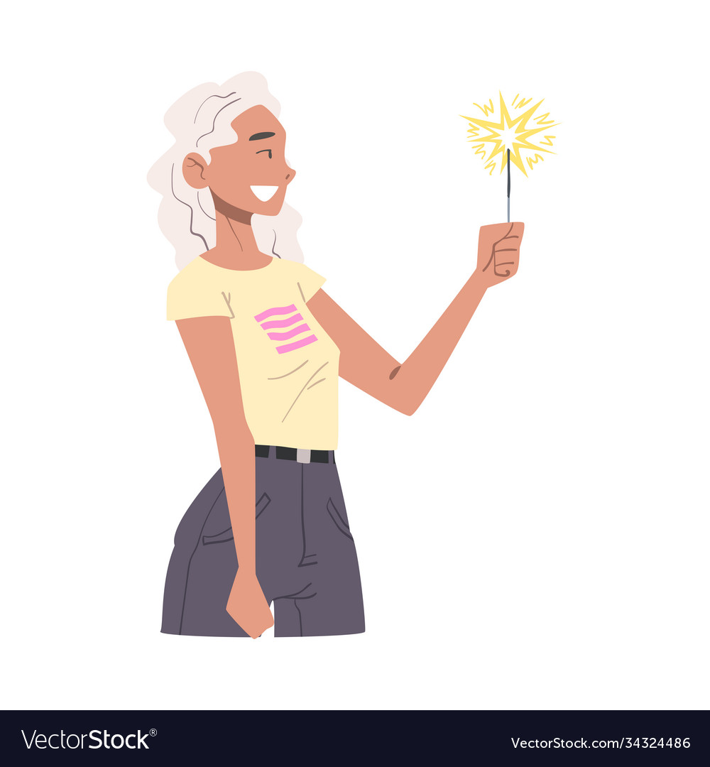 Young woman holding burning sparkler side view