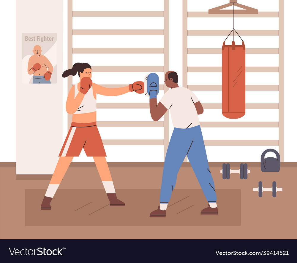 Woman boxing with trainer in gym box coach