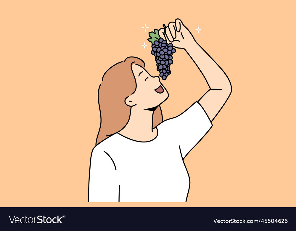 Happy woman enjoy grapes