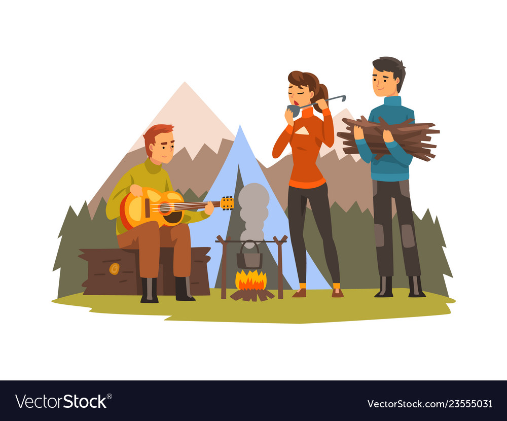 People camping tourists sitting near fire