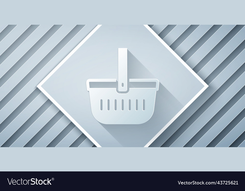 Paper cut picnic basket icon isolated on grey