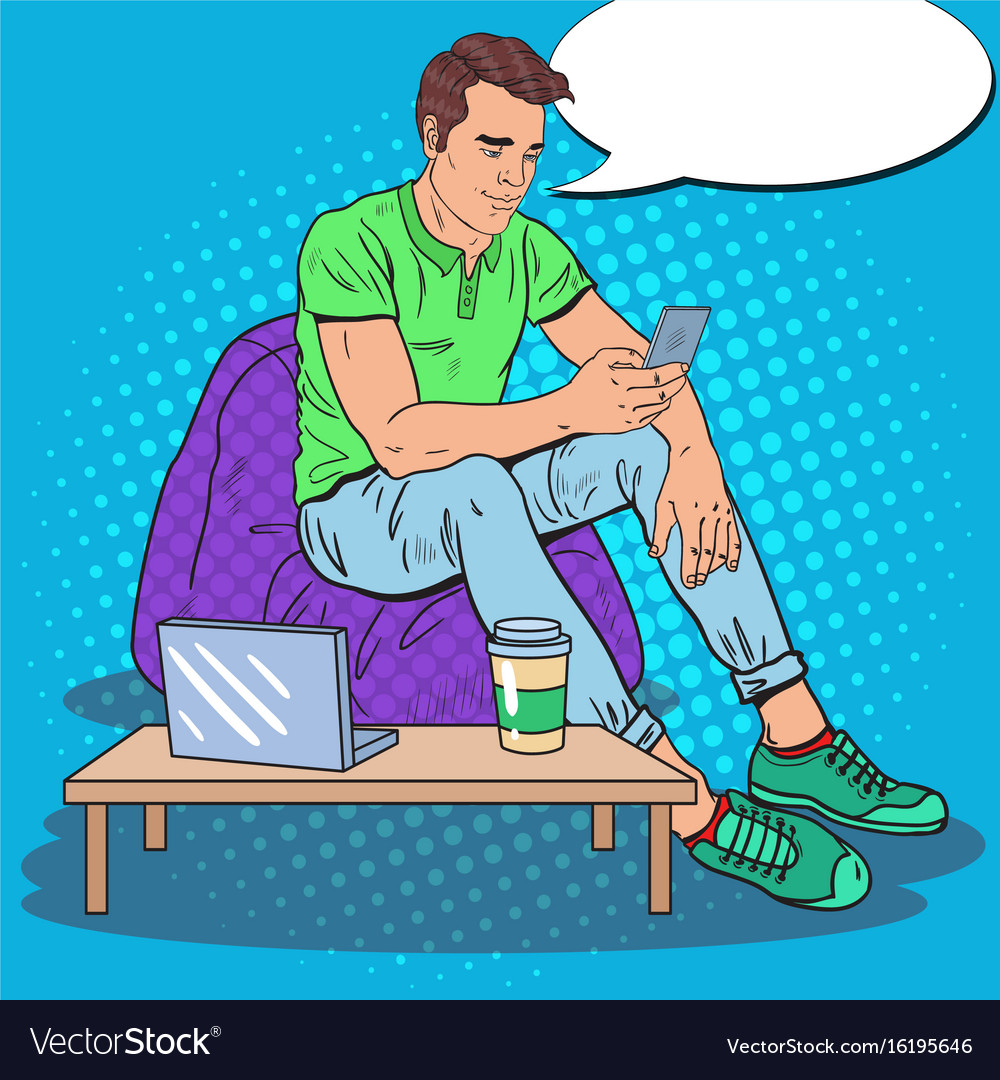 Man Using Laptop and Smartphone