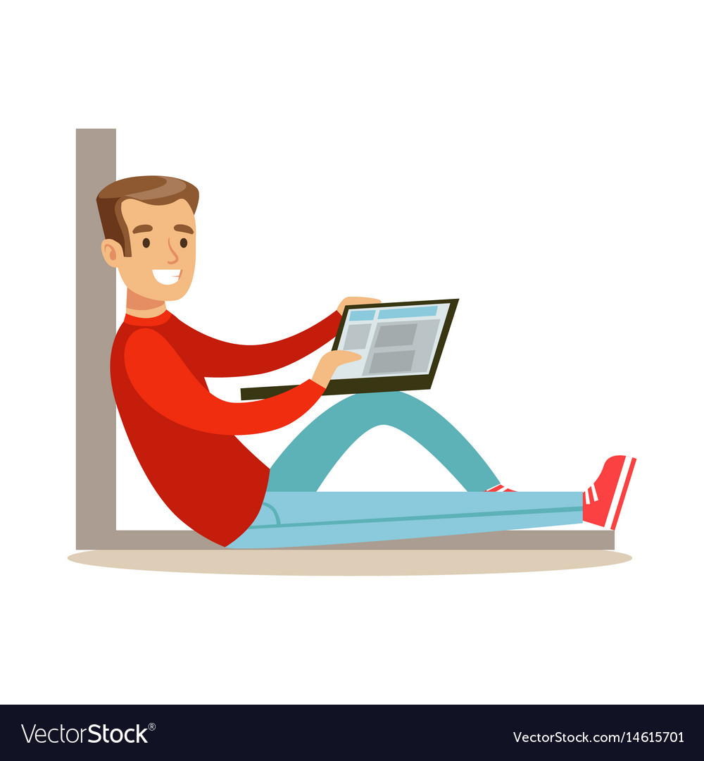Man Using Laptop on Floor