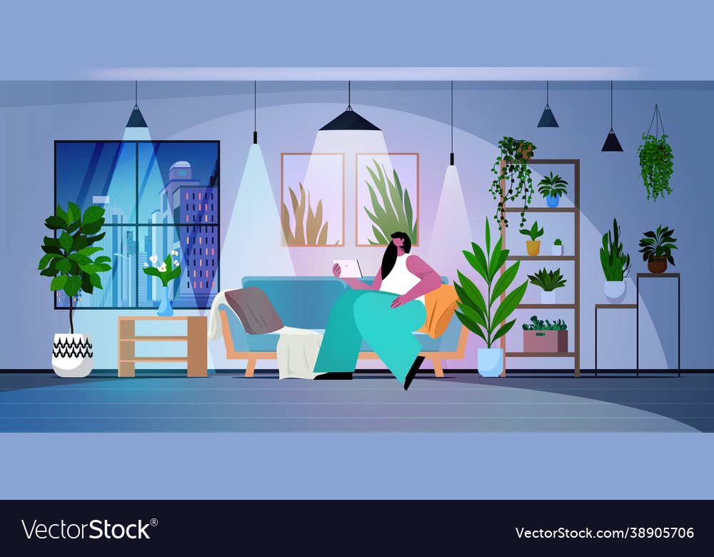Woman using tablet pc in dark night living room vector image Woman using tablet pc in dark night living room
