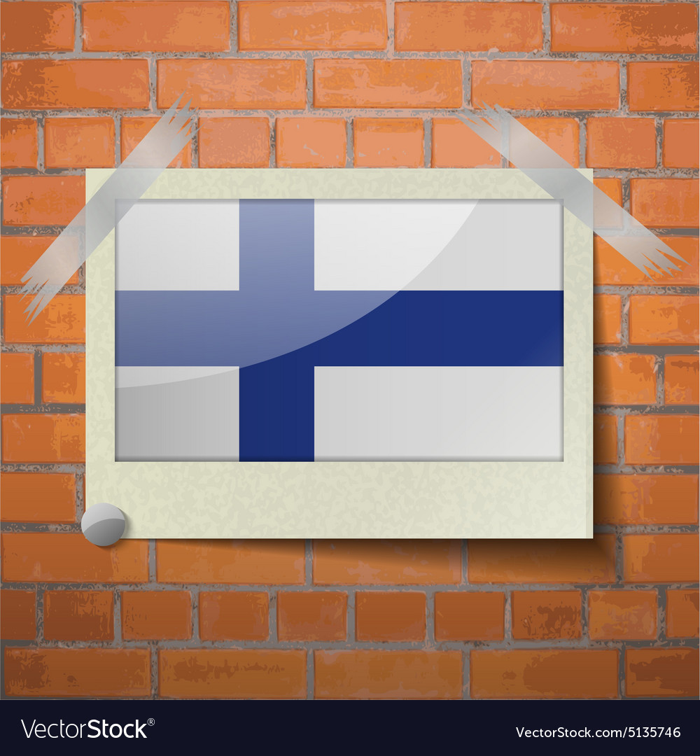 Flags finland scotch taped to a red brick wall