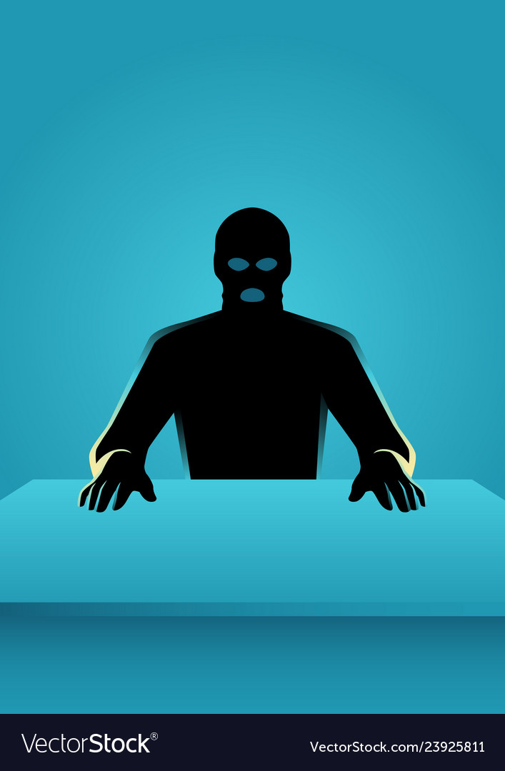Man in mask sitting front of a table