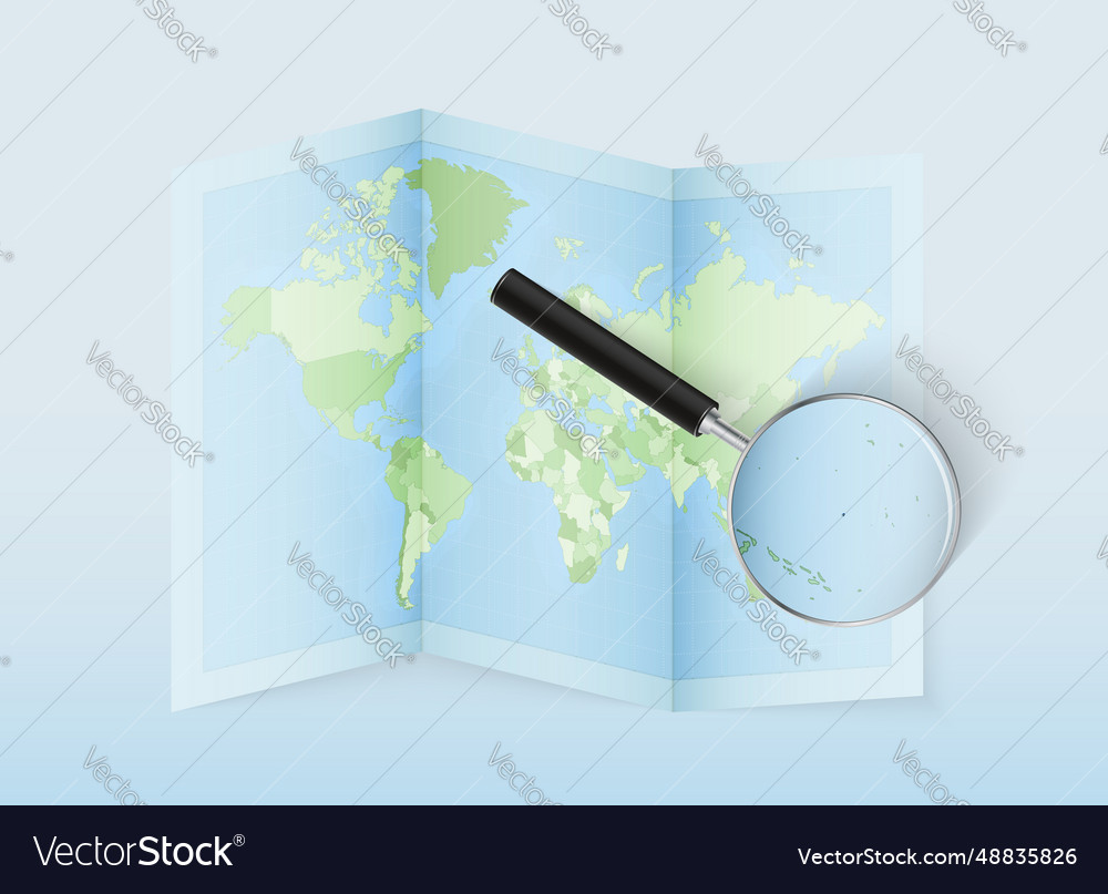 A folded world map with magnifying lens