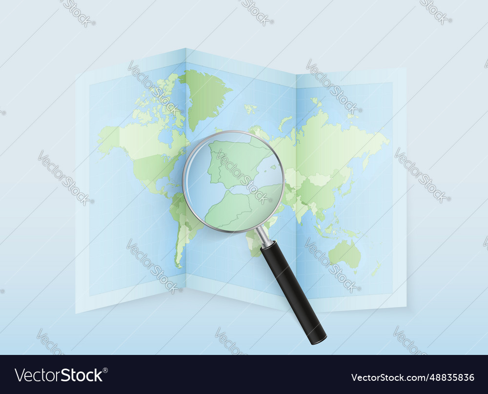 A folded world map with magnifying lens