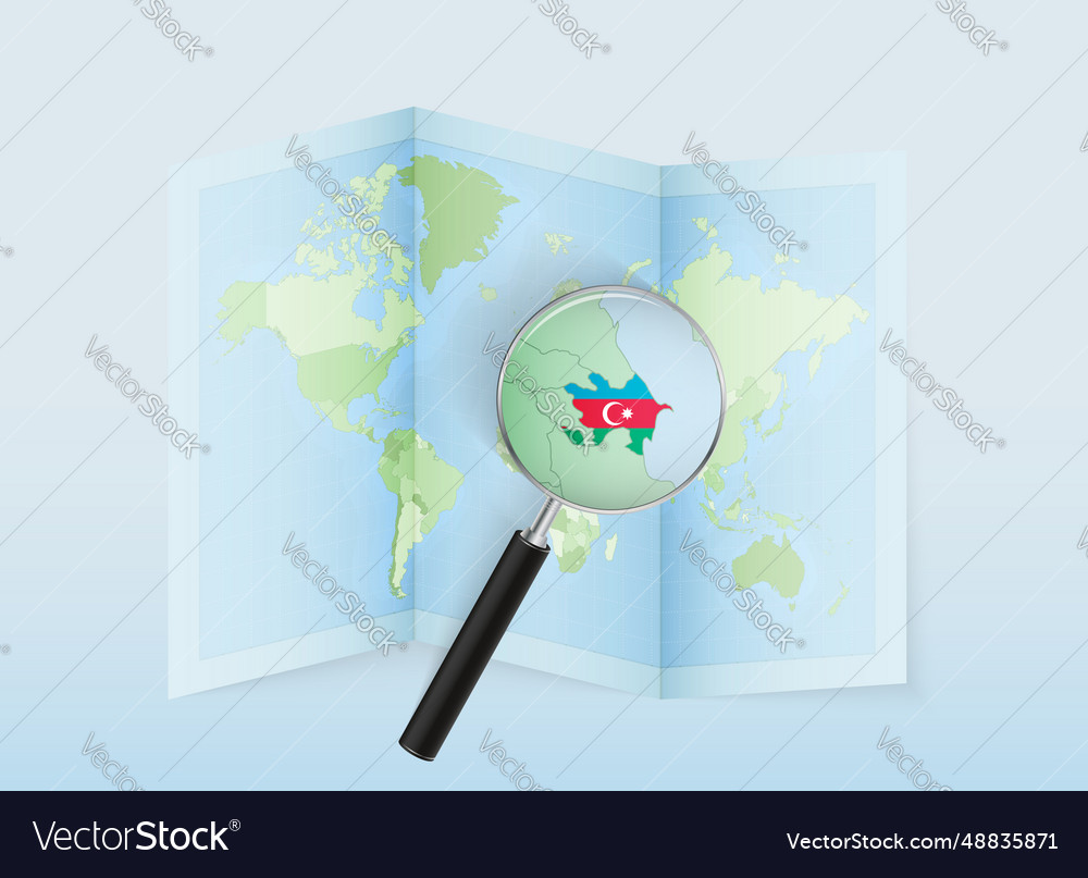 A folded world map with magnifying lens