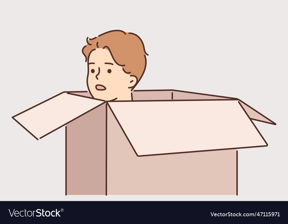 Frightened man hides in carton box trying to avoid