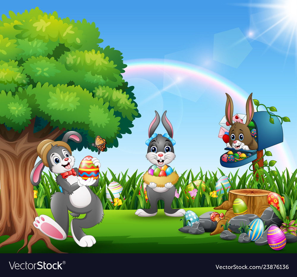 Easter bunnies and colorful egg on the garden