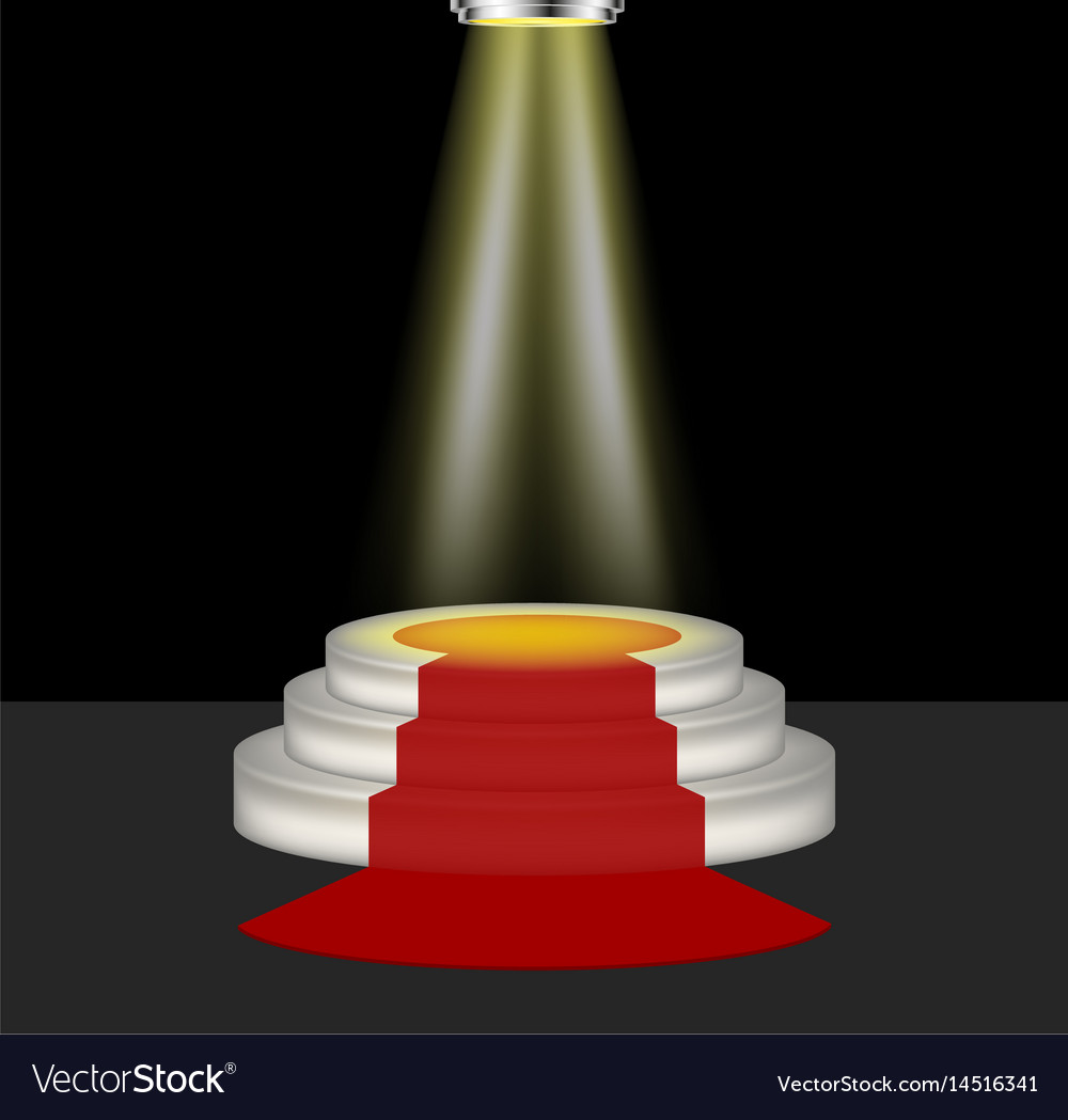 Light shines on the empty podium with red carpet