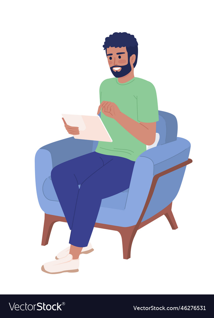 Bearded man with tablet device in armchair semi Vector Image