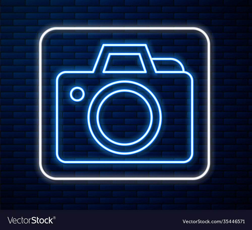 Glowing neon line photo camera icon isolated