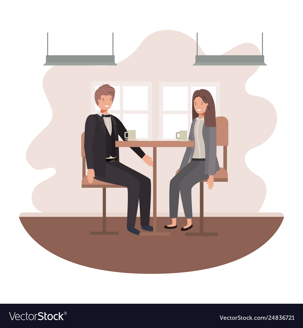 Couple drinking coffee in living room