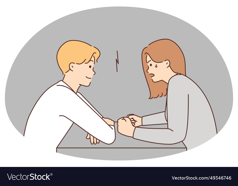 Couple with different moods sit at table