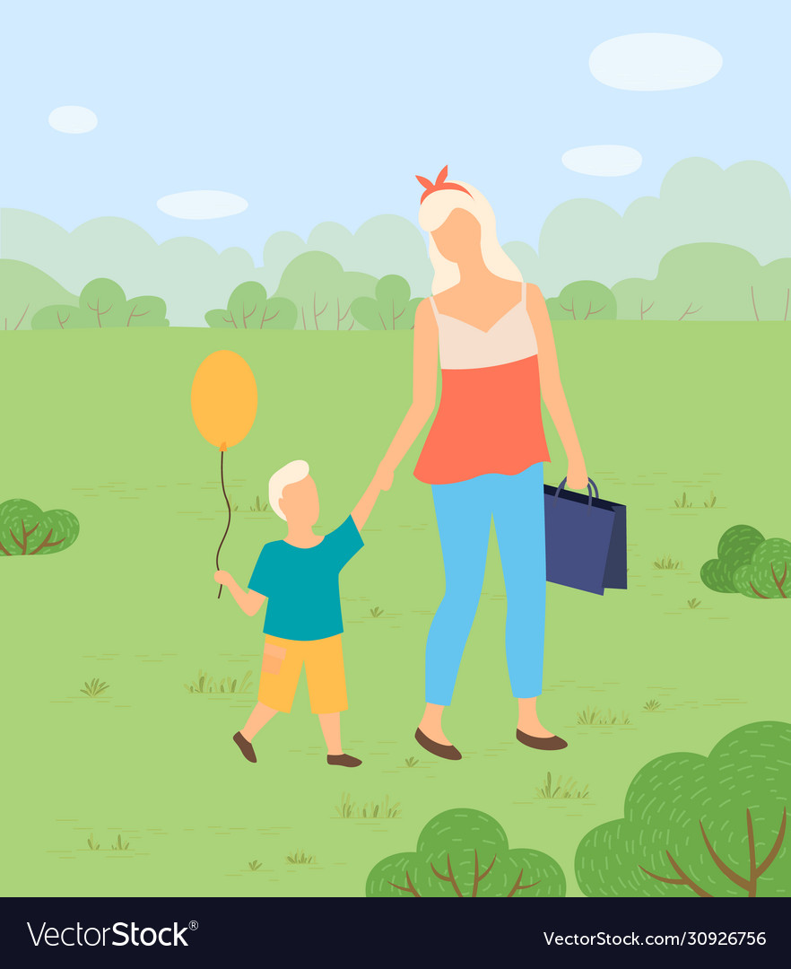 Woman and son with balloon in park walking nature