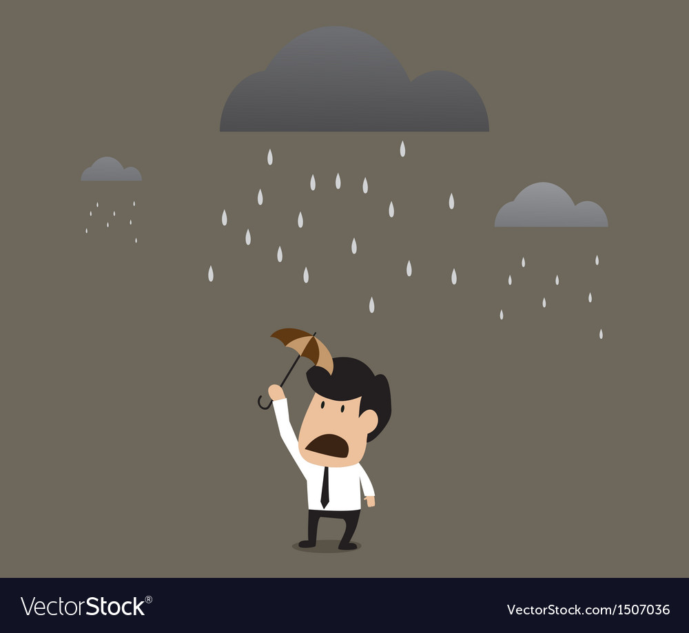 Businessman under a little umbrella in the rain