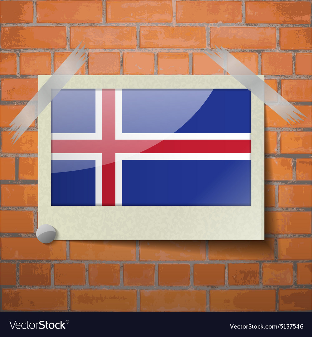 Flags iceland scotch taped to a red brick wall