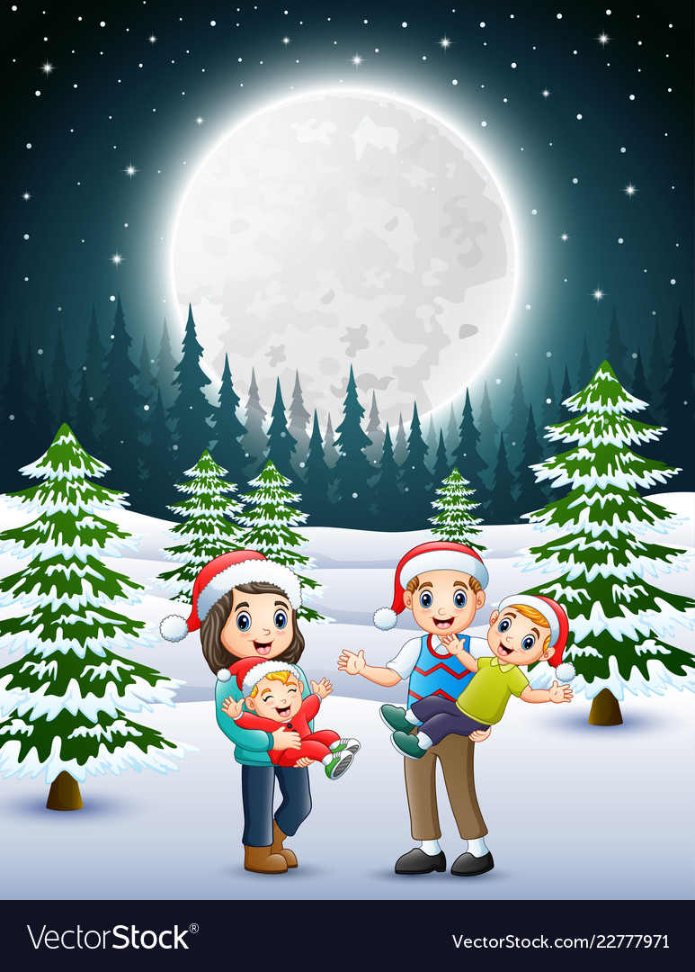 Happy familly in the snowy garden at night