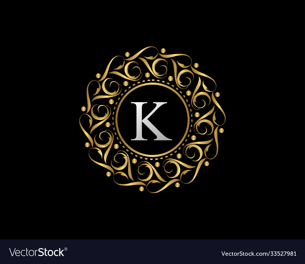 Gold calligraphic badge with letter k design