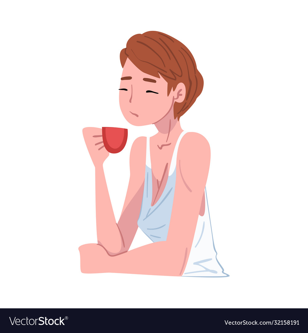 Beautiful young woman drinking tea or coffee girl