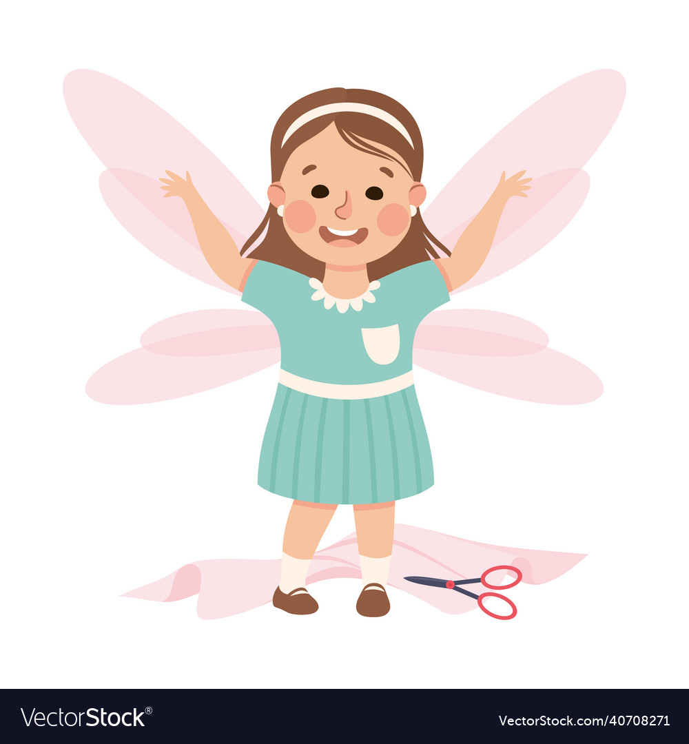 Creative girl having wings cutting them from paper