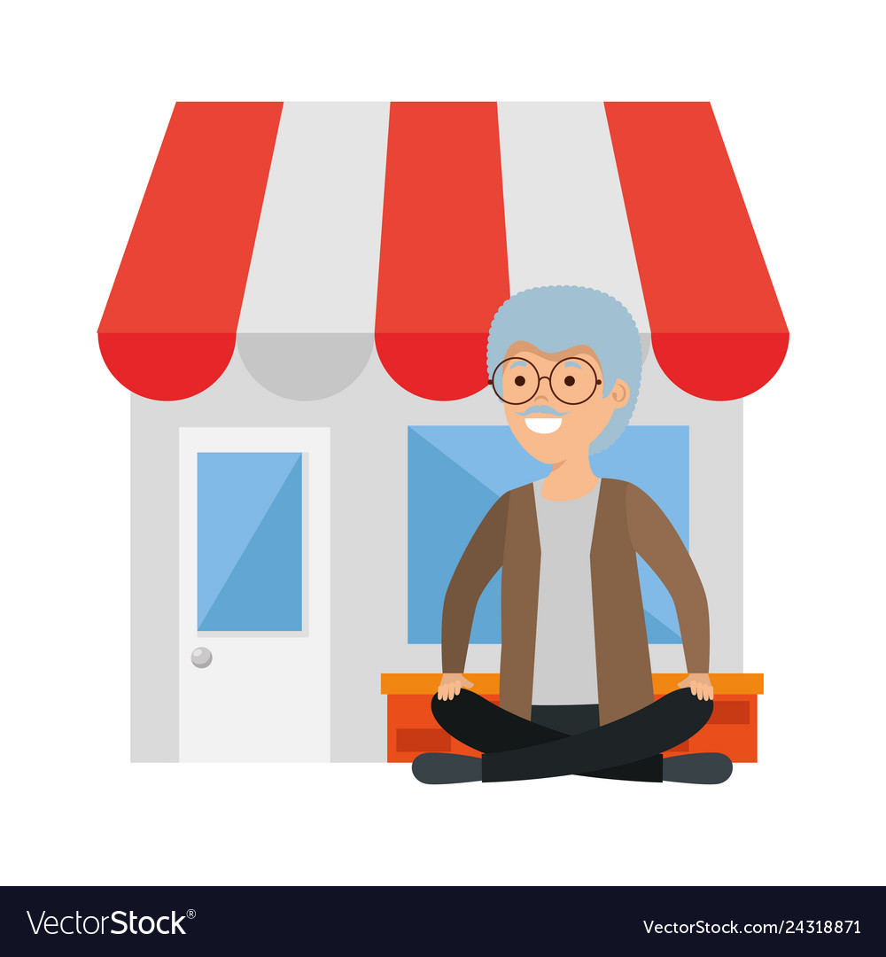 Old man in lotus position with store building