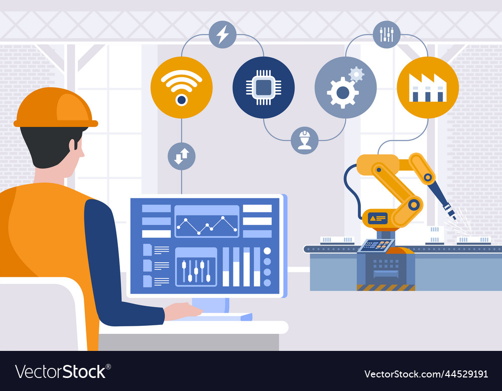 Engineer using computer to control robotic arm