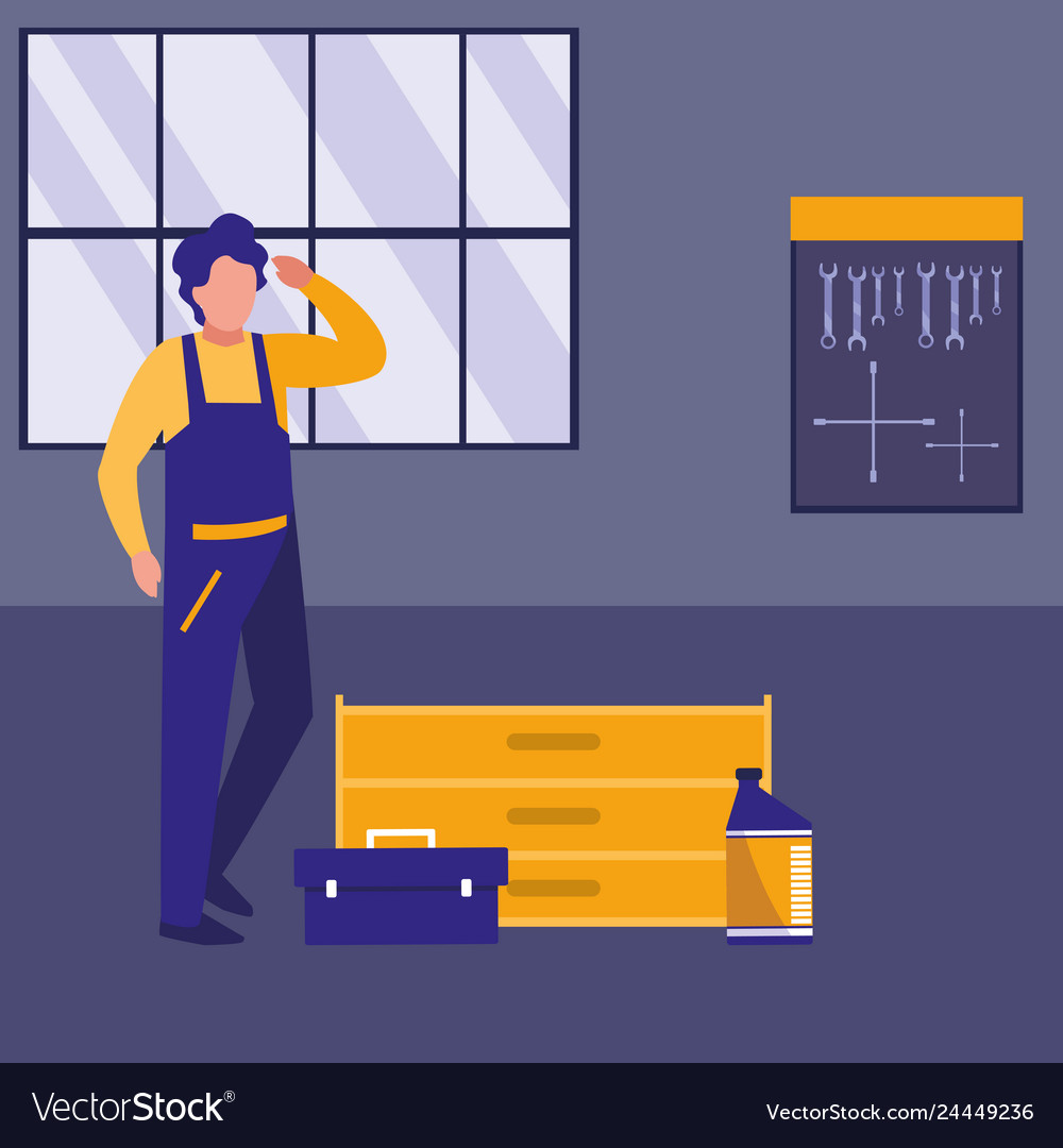 Mechanic worker with toolbox in the workplace