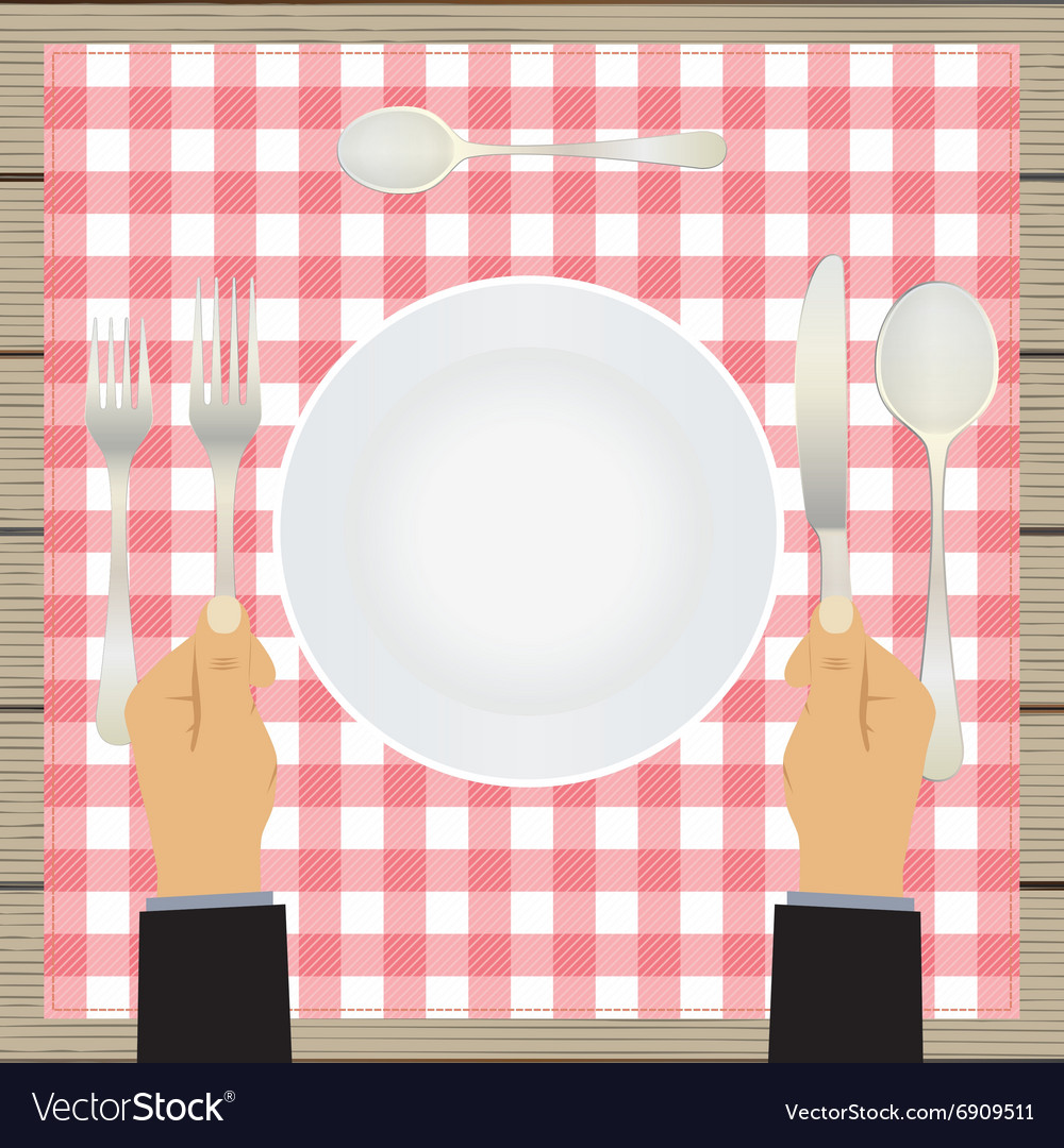 Hand with a knife and fork tableware