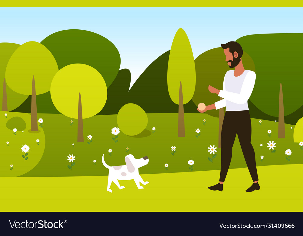 Young man walking with dog outdoors at park guy