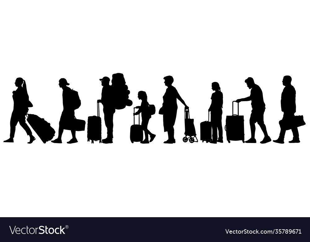 Many tourists with suitcases queue for check-in