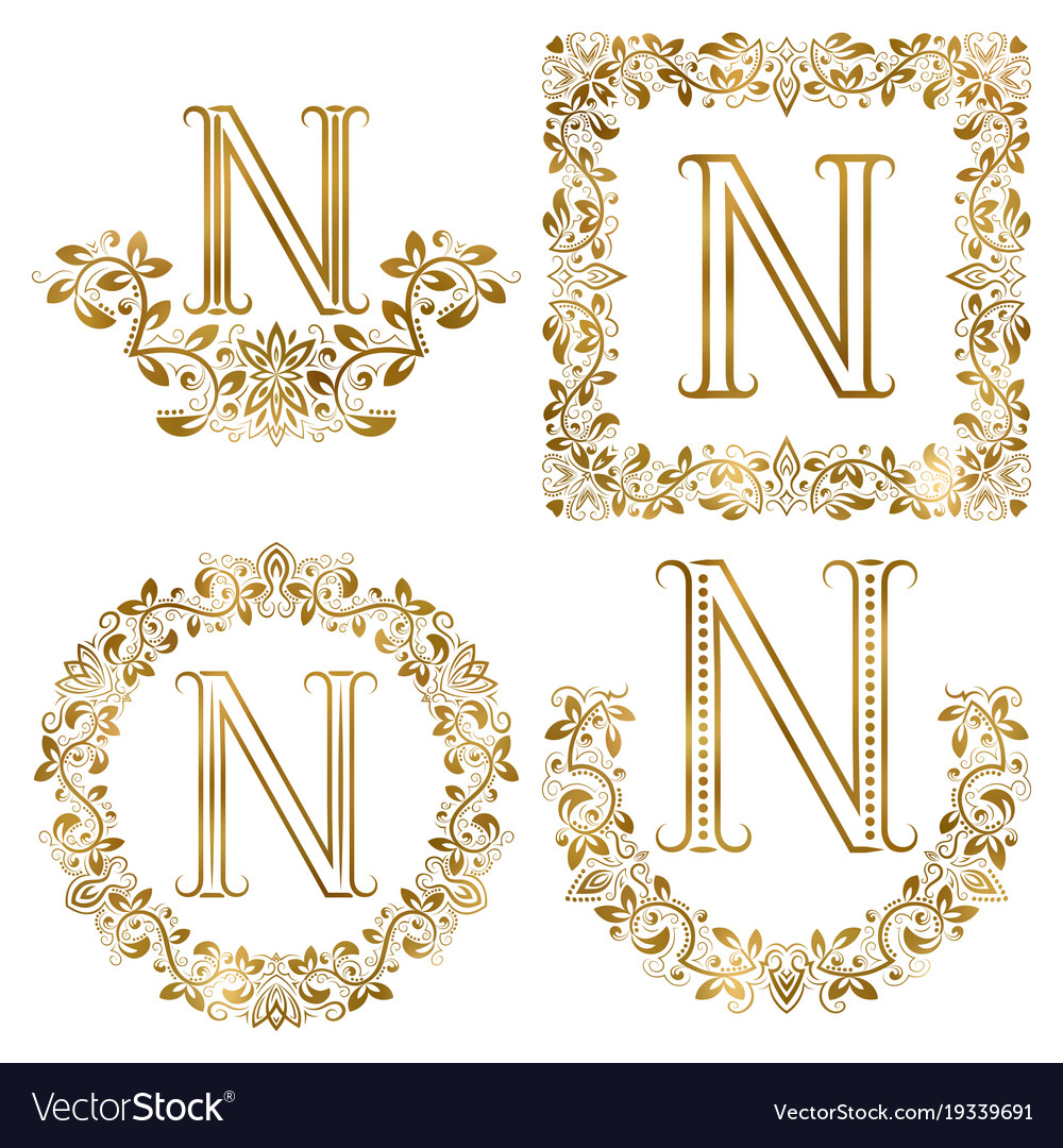 Golden n letter ornamental monograms set heraldic