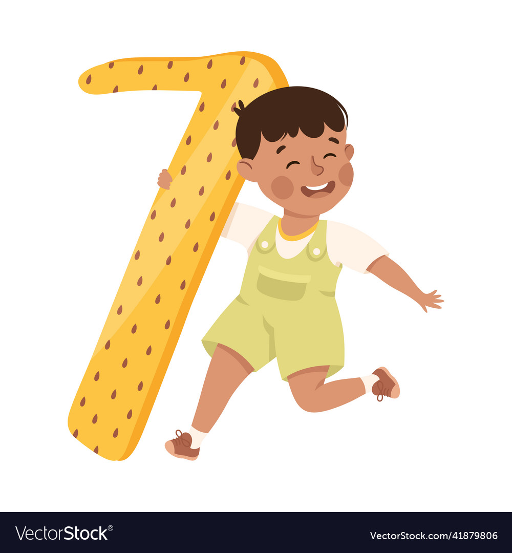 Little boy with huge yellow number seven