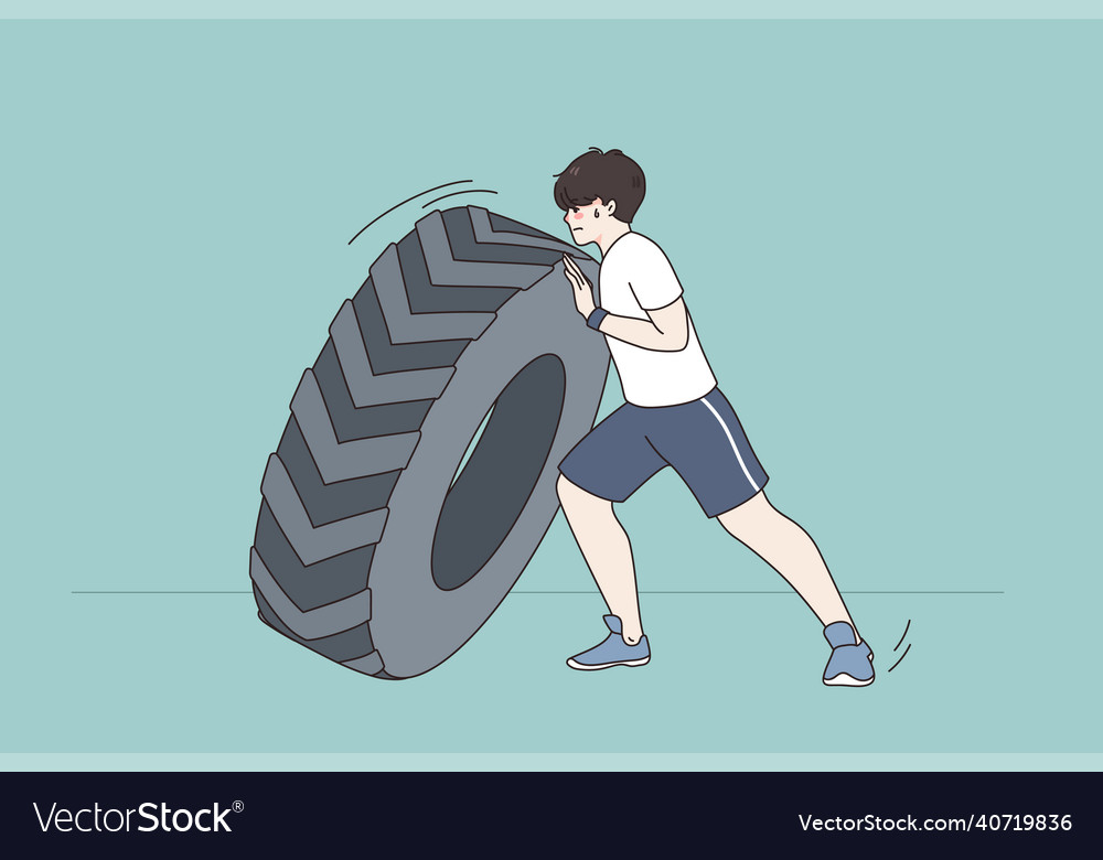 Sportsman push tire training in gym