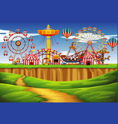 Themepark scene with many rides at day time Vector Image