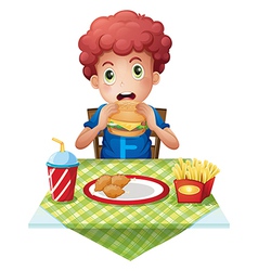 A curly boy eating his breakfast Royalty Free Vector Image