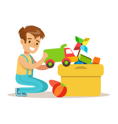 A boy beside a box of toys Royalty Free Vector Image