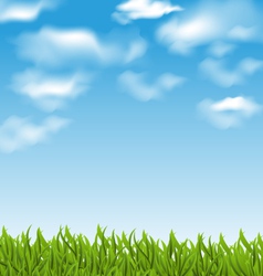 Summer background with green grass blue sky clouds