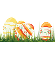 easter eggs in grass vector image vector image