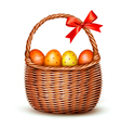 basket with easter eggs and a red bow vector image vector image