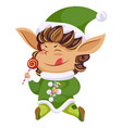 christmas elf or santa helper with lollipop icon vector image vector image