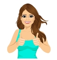 young woman showing thumbs up sign vector image