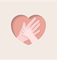 hands of mother and baby in heart shaped paper art vector image vector image