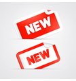 red sticker label tag with new title vector image